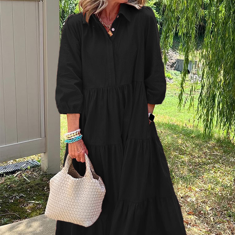 Női bő szabású, bokáig érő ruha hajtókával