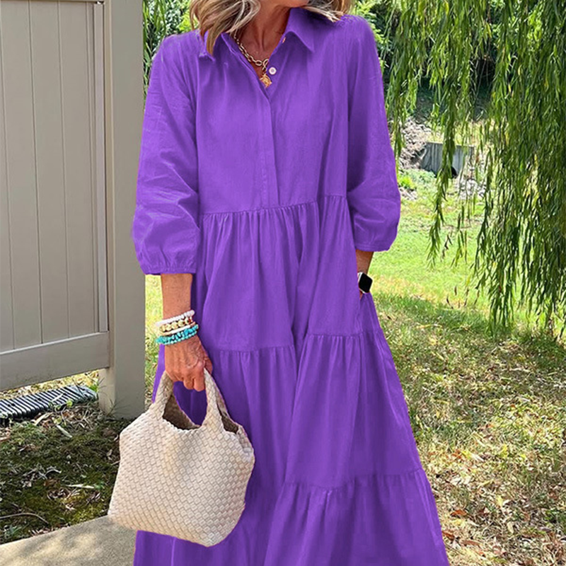 Női bő szabású, bokáig érő ruha hajtókával