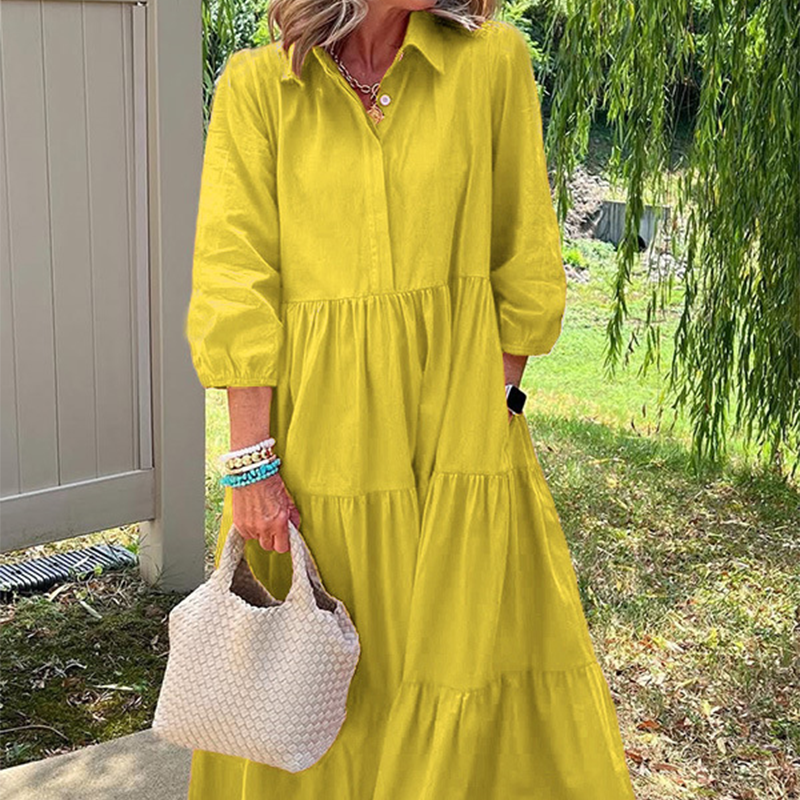 Női bő szabású, bokáig érő ruha hajtókával